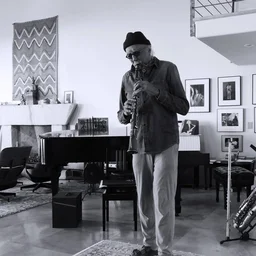 Charles Lloyd with his saxophone at home