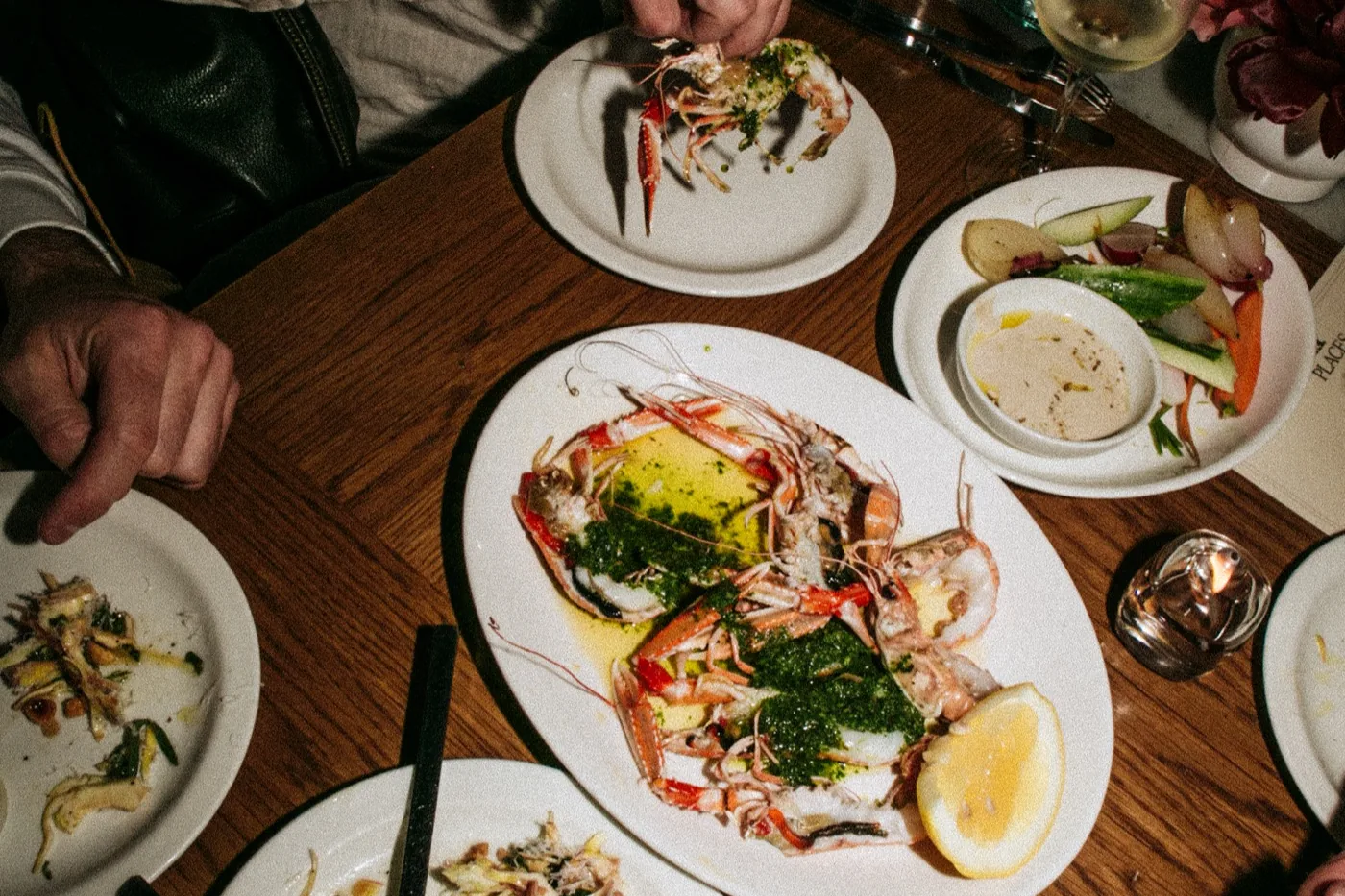 Langoustines and shared plates on a table at Straker's