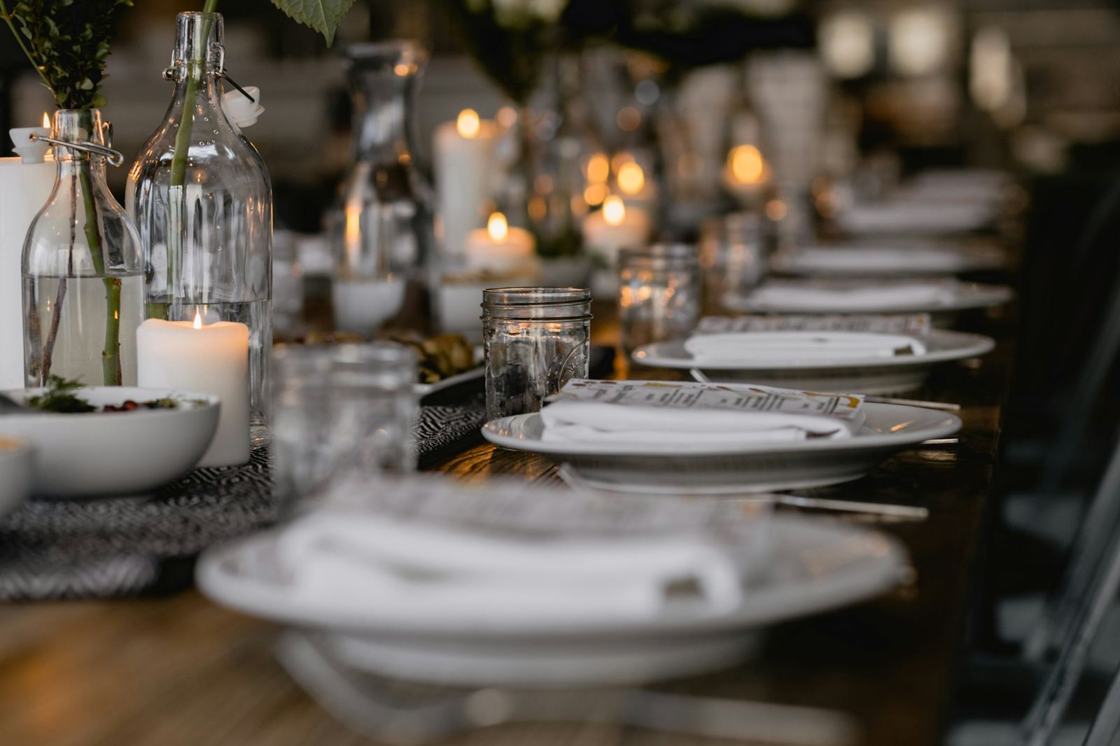 A dinner table set with candles